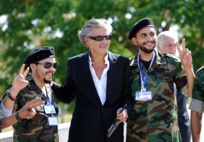French philosopher Bernard-Henri Levy poses with a pro-National Transitional Council (NTC) combatant at the Tripoli Medical Center